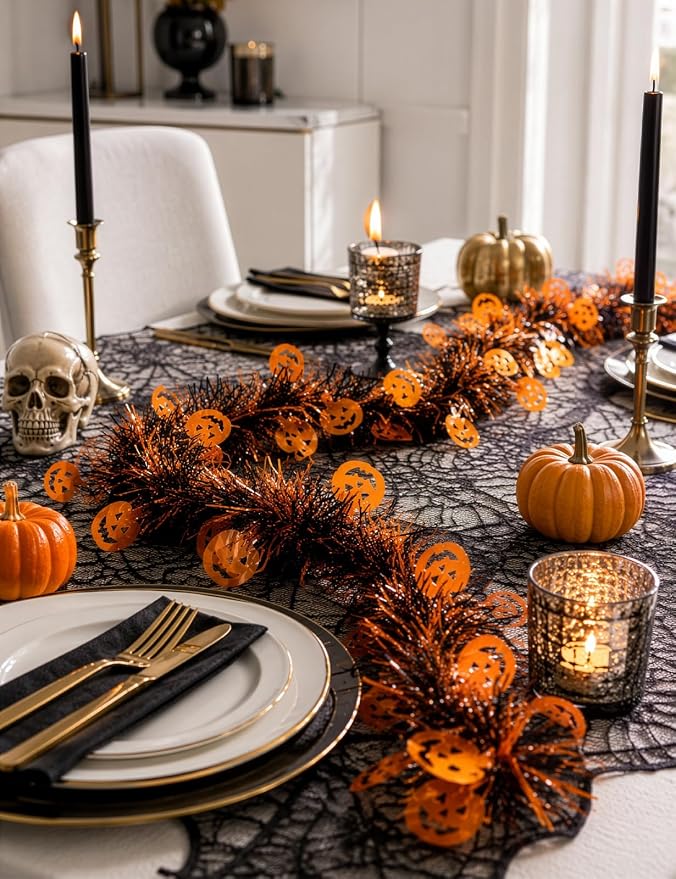 Halloween pumpkin garland arranged along a decorated dining table